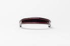 Black and red insert patent leather browband, wide tapered design, turned edge, frontal view showing curved shape