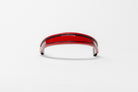 Red and black insert patent leather browband, wide tapered design, turned edge, frontal view with visible curve.