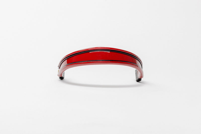 Red and black insert browband, wide tapered design, turned edge, frontal view with visible curve.