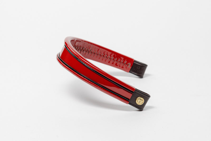 Red and black insert browband, wide tapered design, with turned edge and dark leather ends.