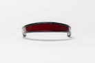 Burgundy and black patent leather browband, wide tapered design, polished brass Freedman logo buttons, and dark leather ends, frontal view.