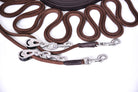 Jog Lines With Cord And Pulley Fronts: Set of Jog Lines with Cord Lines, Metal Pulley Fronts, and Leather Components. Close up of the bolt snap hook
