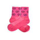 Bright pink socks with repeating circular Freedman's logo pattern in dark blue, laid flat with visible heel and toe details, white background.