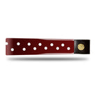 Burgundy Patent Leather Browband with small white dots, wide tapered design, polished brass Freedman logo buttons, and dark leather ends, laid flat.