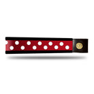 Red and white dot patent leather browband, wide tapered design, turned edge, dark leather ends with gold button, shown flat.