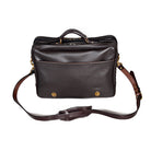 Dark Brown leather briefcase, Wagonette model, with front slip pocket, silver hardware, and detachable shoulder strap.