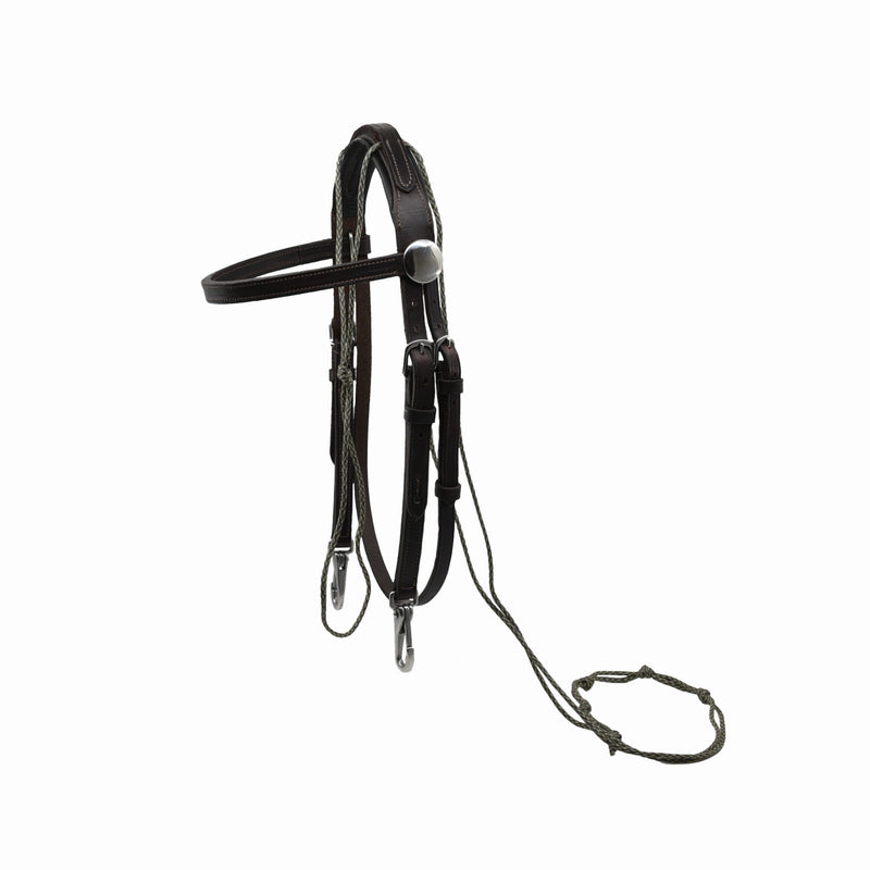 Close-up of an ACTraining Padded Over Check Snap Bridle, showing brown leather construction, padded headstall, buckles, snaps, attached reins, and stitching details, isolated on a white background.