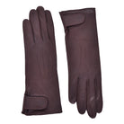 The Yorkville Show Glove, dark brown leather gloves shown separately, each with wrist strap and button detail, visible seam stitching, light background.
