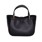 Back view of black leather Mini Cabriolet Bag by Freedman's, showing curved silhouette and top handle.