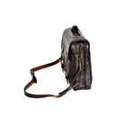 Dark Brown leather briefcase, Wagonette model, angled profile with zipper closure, shoulder strap, and handle detail.