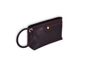 Brown leather Ring Wristlet with patent leather accent and ring detail, angled view.