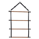Three-tiered Blanket Rack made of solid oak, black stained leather and brass buckles and rings on a white background.